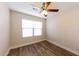 Bedroom with a ceiling fan and bright window at 11829 W Rosewood Dr, El Mirage, AZ 85335