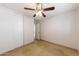 Bedroom featuring ceiling fan, closet, and neutral walls at 11829 W Rosewood Dr, El Mirage, AZ 85335