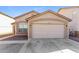 Charming single-story home featuring a two-car garage and landscaped front yard at 11829 W Rosewood Dr, El Mirage, AZ 85335