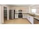 Beautiful kitchen with stainless steel appliances, granite countertops, and ample cabinets at 11829 W Rosewood Dr, El Mirage, AZ 85335