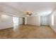Expansive living area with open layout, tile floors, and a welcoming atmosphere at 11829 W Rosewood Dr, El Mirage, AZ 85335