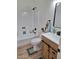 Functional bathroom featuring shower over tub, light wooden vanity and modern fixtures at 1187 E Cowboy Cove Trl, San Tan Valley, AZ 85143