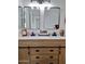 A modern bathroom featuring a double vanity and contemporary mirrors at 1187 E Cowboy Cove Trl, San Tan Valley, AZ 85143