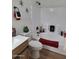 Well-lit bathroom with a bathtub and stylish decor at 1187 E Cowboy Cove Trl, San Tan Valley, AZ 85143