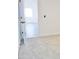 Another bedroom perspective, showcasing neutral carpeting, white walls and an open doorway to the next room at 1187 E Cowboy Cove Trl, San Tan Valley, AZ 85143