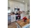 Updated kitchen with stainless steel appliances and sleek white cabinetry at 1187 E Cowboy Cove Trl, San Tan Valley, AZ 85143