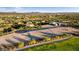 Aerial view of the lot for sale, framed in blue and set in a vibrant golf course community at 30660 N 120Th Ln, Peoria, AZ 85383