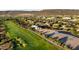 Aerial view of land for sale, marked in blue, overlooking a stunning golf course and residential area at 30660 N 120Th Ln, Peoria, AZ 85383