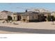 Stunning home with desert landscaping and stone accents on the front elevation at 30660 N 120Th Ln, Peoria, AZ 85383