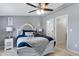 Cozy bedroom showcasing a well-dressed bed, neutral decor, and a glimpse into the en-suite bathroom creating a private retreat at 320 E Mckellips Rd # 34, Mesa, AZ 85201