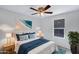 Inviting bedroom highlighting a cozy bed, beach-themed wall art, and natural light creating a relaxing and private space at 320 E Mckellips Rd # 34, Mesa, AZ 85201