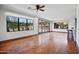 Spacious living room with hardwood floors, lots of natural light and glass doors to the patio at 4518 E Solano Dr, Phoenix, AZ 85018
