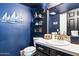 Nautical bathroom with stylish vanity, wall shelves, and maritime-themed decorations at 7756 N 19Th Ln, Phoenix, AZ 85021