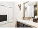 Modern bathroom with stylish vanity, shower and decorative mirror at 7756 N 19Th Ln, Phoenix, AZ 85021