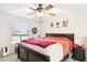 Comfortable bedroom with a large bed, ceiling fan, and neutral walls, creating a relaxing space at 7756 N 19Th Ln, Phoenix, AZ 85021