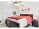 Spacious bedroom featuring ceiling fan, nightstand, and wall decor at 7756 N 19Th Ln, Phoenix, AZ 85021