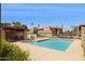 Community pool area with poolside furniture, pergola, and well-maintained landscaping at 7756 N 19Th Ln, Phoenix, AZ 85021