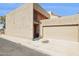 Beige two-story home featuring an attached two car garage, and a neutral desert landscape at 7756 N 19Th Ln, Phoenix, AZ 85021