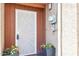 Up close shot of front door with potted plants and security door at 7756 N 19Th Ln, Phoenix, AZ 85021