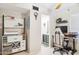 Bright home office featuring built-in storage, desk and gaming chair with bath access at 7756 N 19Th Ln, Phoenix, AZ 85021
