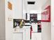 Bright kitchen featuring white cabinets, black backsplash, and modern countertops at 7756 N 19Th Ln, Phoenix, AZ 85021