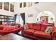 Bright living area features large windows and a unique red chair at 7756 N 19Th Ln, Phoenix, AZ 85021