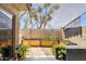 Outdoor patio area featuring raised garden beds and privacy screening at 7756 N 19Th Ln, Phoenix, AZ 85021