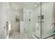 Modern bathroom with glass shower door, stone bench and built in storage at 7955 E Chaparral Rd # 17, Scottsdale, AZ 85250