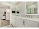 Bright bathroom featuring double vanity with white cabinets and quartz countertop at 7955 E Chaparral Rd # 17, Scottsdale, AZ 85250