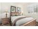 Charming bedroom with a cozy bed, two nightstands, and a window with blinds at 7955 E Chaparral Rd # 17, Scottsdale, AZ 85250