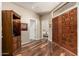 Inviting entryway with wood floors, double doors, and views into the home at 7955 E Chaparral Rd # 17, Scottsdale, AZ 85250