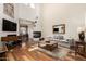 Open-concept living room with fireplace and views into the dining room at 7955 E Chaparral Rd # 17, Scottsdale, AZ 85250