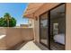Relaxing patio with stucco walls that exits from primary bedroom at 7955 E Chaparral Rd # 17, Scottsdale, AZ 85250