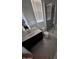 This bathroom features a modern vanity, toilet, and glass-enclosed shower at 9548 E Rainbow Ave, Mesa, AZ 85212