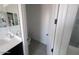 Bathroom features a modern vanity, mirrors and a glass-enclosed shower at 9548 E Rainbow Ave, Mesa, AZ 85212