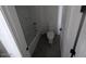 Clean, white bathroom with a shower-tub combination and a toilet at 9548 E Rainbow Ave, Mesa, AZ 85212