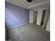 A spacious bedroom featuring modern architectural wall accents and ample closet space at 9548 E Rainbow Ave, Mesa, AZ 85212
