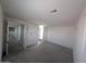 Spacious and bright room with carpet flooring, white walls, and natural light from the window at 9548 E Rainbow Ave, Mesa, AZ 85212