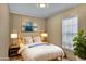 The bedroom includes a window, comfortable queen bed, and a matching nightstand at 320 E Mckellips Rd # 186, Mesa, AZ 85201