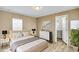 A well-lit main bedroom with an ensuite bathroom features a neutral color palette and ample natural light at 320 E Mckellips Rd # 186, Mesa, AZ 85201