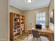 A well-lit office featuring a large desk and a bookshelf at 320 E Mckellips Rd # 186, Mesa, AZ 85201