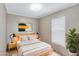 Well-lit bedroom featuring a comfortable bed, neutral tones, and a minimalist decor at 320 E Mckellips Rd # 195, Mesa, AZ 85201
