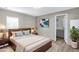 Cozy main bedroom featuring a comfortable bed, stylish decor, and ensuite bathroom access at 320 E Mckellips Rd # 195, Mesa, AZ 85201