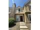 Close-up of an exterior showcasing brick accents, front door, and the architectural details of the townhouse at 3324 W Mcrae Way # 2, Phoenix, AZ 85027