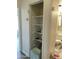 Open hallway closet with white shelving, offering practical storage solutions for linens, toiletries, and other household items at 3324 W Mcrae Way # 2, Phoenix, AZ 85027