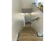 Wooden staircase with white walls and a single wooden railing, leading to the next level of the house at 3324 W Mcrae Way # 2, Phoenix, AZ 85027