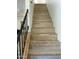 Staircase features black metal railing and wooden stairs, showcasing a transition between levels in the home at 3324 W Mcrae Way # 2, Phoenix, AZ 85027