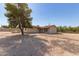 Expansive backyard with a patio, featuring desert landscaping and providing ample space for outdoor activities and entertaining at 44446 N 14Th St, New River, AZ 85087
