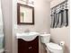 Bathroom featuring a vanity, mirror, toilet, and privacy window at 44446 N 14Th St, New River, AZ 85087