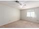 Bedroom featuring neutral walls, carpet, a window, and a ceiling fan at 44446 N 14Th St, New River, AZ 85087